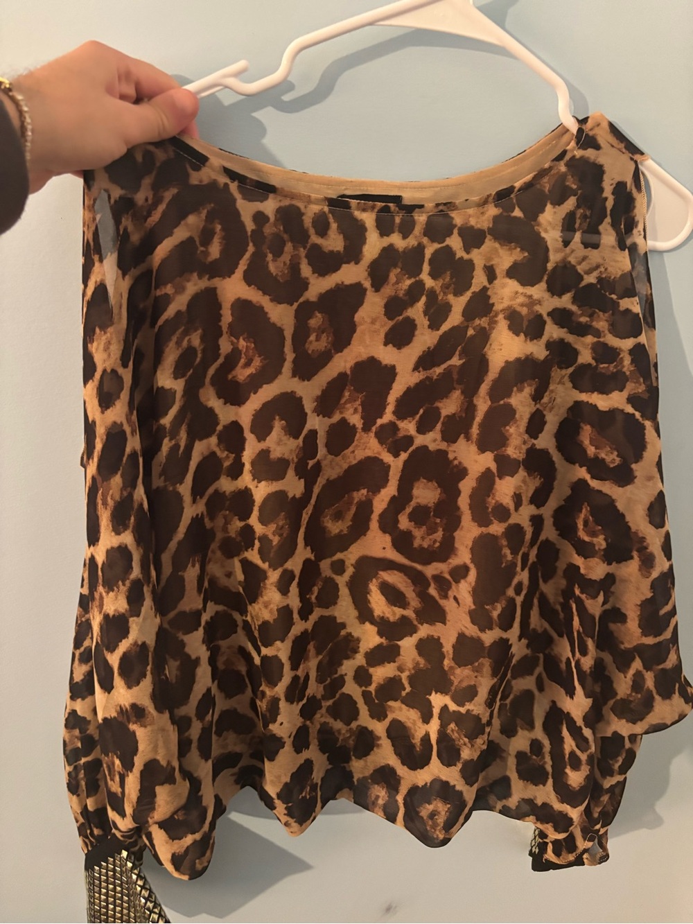 Leopard Print Women's top size small has opens on shoulders, from miss avenue